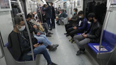 Iranian commuters wear face masks in a metro after Iranian authorities made it mandatory for all to wear face masks in public following the outbreak of the coronavirus disease (COVID19), in Tehran Iran October 10, 2020. Majid Asgaripour/WANA (West Asia News Agency) via REUTERS ATTENTION EDITORS - THIS IMAGE HAS BEEN SUPPLIED BY A THIRD PARTY.