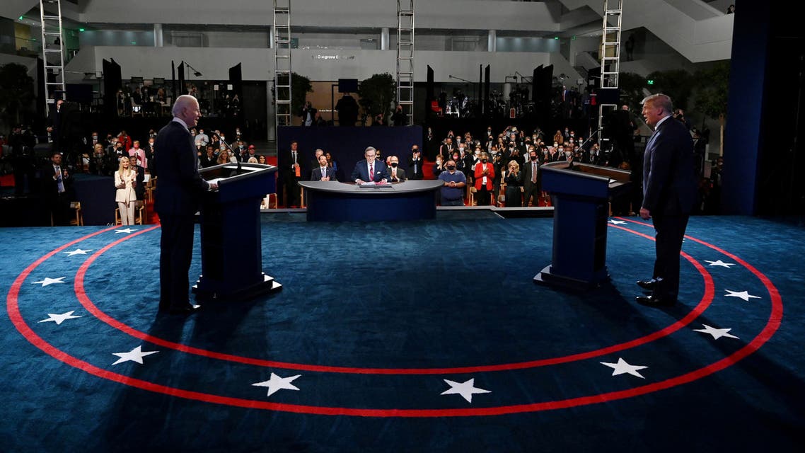 FILE PHOTO: U.S. President Donald Trump and Democratic presidential nominee Joe Biden participate in their first 2020 presidential campaign debate held on the campus of the Cleveland Clinic at Case Western Reserve University in Cleveland, Ohio, U.S., September 29, 2020. Olivier Douliery/Pool via REUTERS/File Photo