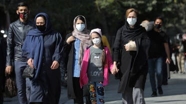Iranians wearing face masks walk on a street after Iranian authorities made it mandatory for all to wear face masks in public following the outbreak of the coronavirus disease (COVID19), in Tehran Iran October 10, 2020. Majid Asgaripour/WANA (West Asia News Agency) via REUTERS ATTENTION EDITORS - THIS IMAGE HAS BEEN SUPPLIED BY A THIRD PARTY.