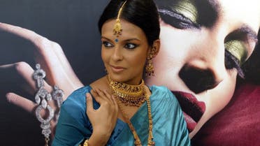 A model displays period and traditional gold jewelry 'Revitalizer of Tradition' at the launch of a concept jewelry store by Tanishq in Calcutta, India. (AP)