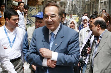 A file photo shows Egyptian actor Yassin, a Good Will Ambassador of the WFP, tours a suburb in Damascus, to check the conditions of Iraqi refugees in Syria, April 15, 2008. (AP Photo/Bassem Tellawi)