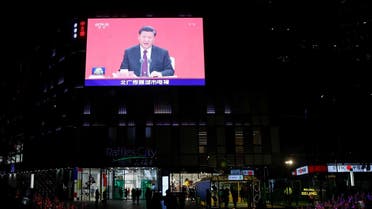 A giant screen shows news footage of Chinese President Xi Jinping speaking at an event marking the 40th anniversary of the establishment of Shenzhen Special Economic Zone, outside a shopping mall in Beijing, China, on October 14, 2020. (Reuters)