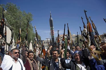 Houthis raise weapons as they chant slogans during a gathering aimed at mobilizing more fighters in Sanaa, Yemen, February, 25, 2020. (AP)