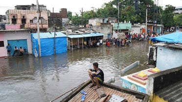 People are seen in a flooded residential area after heavy rainfall in Hyderabad, the capital of the southern state of Telangana, India, on October 14, 2020. (Reuters)_2111886462_RC2BIJ9IKUU4_RTRMADP_3_INDIA-FLOODS