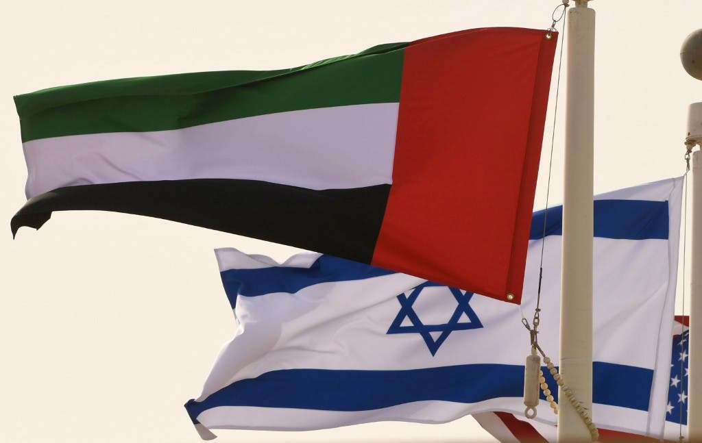 The Emirati, Israeli and US flags sway in the wind at the Abu Dhabi airport at the arrival of the first-ever commercial flight from Israel to the UAE, on August 31, 2020. (AFP)