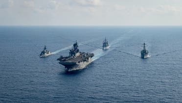 Australian Navy HMAS Parramatta (FFH 154) (L) sails with USS America, USS Bunker Hill (CG 52) and USS Barry (DDG 52) in the South China Sea, April 18, 2020. (Reuters)