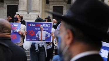 Protesters rally in Manhattan against the closing of some schools and businesses in Jewish neighborhoods in the Brooklyn and Queens boroughs due to a spike in the numbers of Covid-19 cases in these neighborhoods on October 15, 2020 in New York City. (AFP)