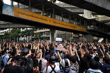 Pro-democracy protesters show the three-finger salute as they gather demanding the government to resign and to release detained leaders in Bangkok, Thailand, on October 15, 2020. (Reuters)