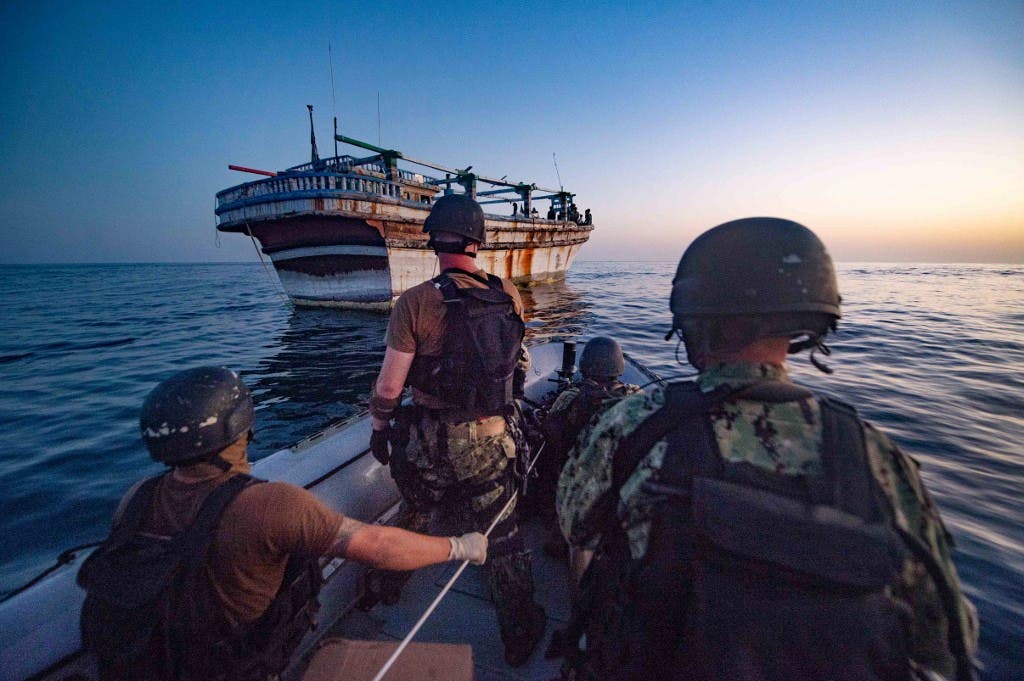 A handout picture released on October 15, 2020 by the Combined Maritime Forces (CMF) shows crew of the destroyer USS Winston S. Churchill heading to provided assistance to an Iranian-flagged motor vessel in distress in the Gulf water off Oman. (AFP)