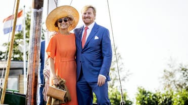 King Willem-Alexander of the Netherlands (R) and Queen Maxima of the Netherlands pose during a visit to a sailing school De Veenhoop in Veenhoop, the Netherlands on September 17, 2020. (AFP)