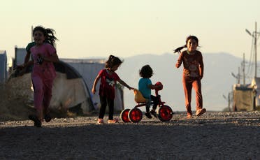 Displaced Iraqi children from the minority Yazidi sect, who fled the Iraqi town of Sinjar, play at the Khanki camp on the outskirts of Dohuk province, July 31, 2019. Picture taken July 31, 2019.  (Reuters)