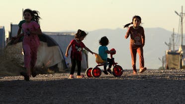 Displaced Iraqi children from the minority Yazidi sect, who fled the Iraqi town of Sinjar, play at the Khanki camp on the outskirts of Dohuk province, July 31, 2019. Picture taken July 31, 2019.  (Reuters)
