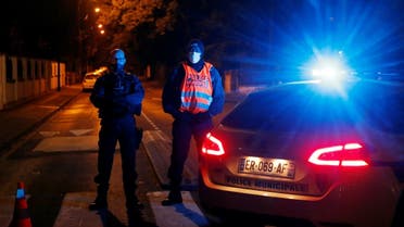 Police officers secure the area near the scene of a stabbing attack in the Paris suburb of Conflans St Honorine, France, October 16, 2020. (Reuters)
