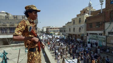 A fighter loyal to Yemen's Huthi rebels stands guard during a rally commemorating the death of Shia Imam Zaid bin Ali in the capital Sanaa, on September 14, 2020. (AFP)