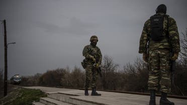 Greek army officers patrol at the railway station of Kastanies village, near the Greek-Turkish border on March 8, 2020. (AFP)