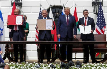 Bahrain’s Foreign Minister Abdullatif Al Zayani, Israel's Prime Minister Benjamin Netanyahu and United Arab Emirates (UAE) Foreign Minister Abdullah bin Zayed display their copies of signed agreements while U.S. President Donald Trump looks on as they participate in the signing ceremony of the Abraham Accords, normalizing relations between Israel and some of its Middle East neighbors, in a strategic realignment of Middle Eastern countries against Iran, on the South Lawn of the White House in Washington, U.S., September 15, 2020. (File photo: Reuters/Tom Brenner)