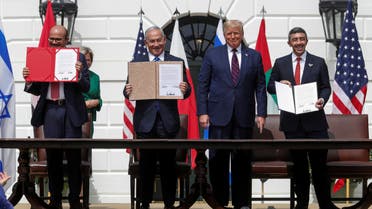 Bahrain’s Foreign Minister Abdullatif Al Zayani, Israel's Prime Minister Benjamin Netanyahu and United Arab Emirates (UAE) Foreign Minister Abdullah bin Zayed display their copies of signed agreements while U.S. President Donald Trump looks on as they participate in the signing ceremony of the Abraham Accords, normalizing relations between Israel and some of its Middle East neighbors, in a strategic realignment of Middle Eastern countries against Iran, on the South Lawn of the White House in Washington, U.S., September 15, 2020. (Reuters)