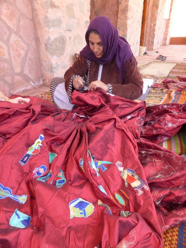 FanSina founder Selema Gebaly, working on the dress in Saint Catherine, Sinai, Egypt. (Supplied: Kirstie Macleod)