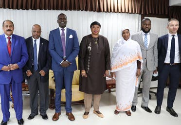 Prosecutor of the International Criminal Court, Fatou Bensouda (C) poses with Sudanese officials, including Minister of Justice Nasruddin Abdel Bari (3rd L), during her visit to the ministry of justice in Khartoum on October 18, 2020. (AFP)