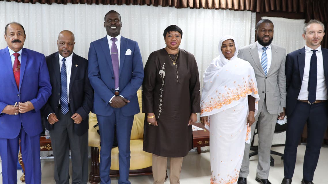 Prosecutor of the International Criminal Court, Fatou Bensouda (C) poses with Sudanese officials, including Minister of Justice Nasruddin Abdel Bari (3rd L), during her visit to the ministry of justice in Khartoum on October 18, 2020. (AFP)