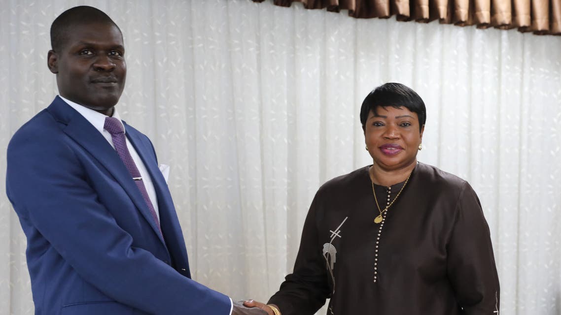 Sudan's Minister of Justice Nasruddin Abdel Bari(L) shakes hands with the International Criminal Court prosecutor Fatou Bensouda during her visit to the capital Khartoum on October 18, 2020. The International Criminal Court prosecutor is on an official visit to Sudan to discuss the potential extradition of former president Omar al-Bashir, the government said. The toppled autocrat is wanted by the ICC on charges of genocide and crimes against humanity in the western region of Darfur.