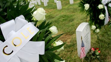 Wreaths are placed by the graves of sailors who died on the USS Cole at the Arlington National Cemetery in Virginia, Oct. 12, 2005. (Reuters)