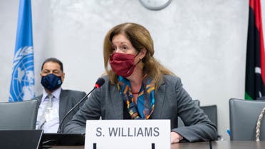 This handout picture distributed by the United Nations Office at Geneva shows Deputy Special Representative of the UN Secretary-General for Political Affairs in Libya Stephanie Williams wearing a face mask during talks between the rival factions in the Libya conflict, as they resume on October 19, 2020, in Geneva. Talks between the rival factions in the Libya conflict resumed in Geneva on October 19, the UN said, as the 5+5 Joint Military Commission (JMC) met for the fourth time.