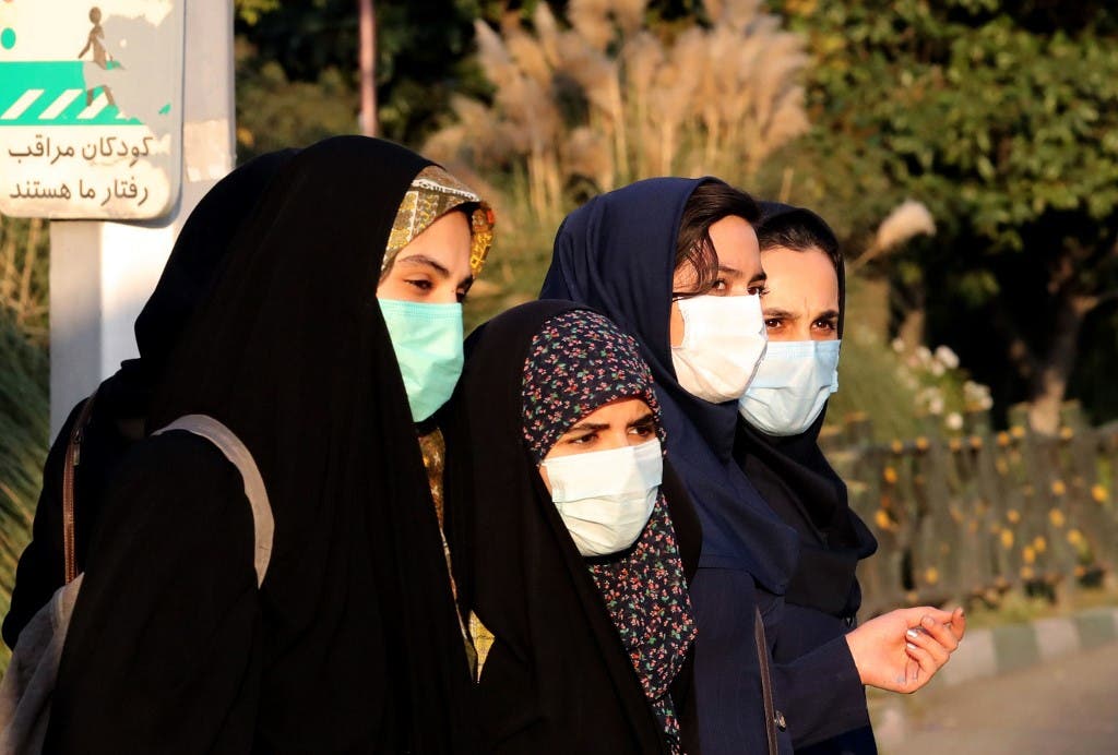 Iranian women wear face masks as a Covid-19 coronavirus pandemic precaution, in Iran's capital Tehran on October 19, 2020. (AFP)