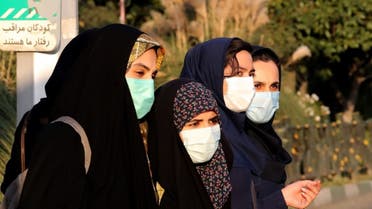 Iranian women wear face masks as a Covid-19 coronavirus pandemic precaution, in Iran's capital Tehran on October 19, 2020. (AFP)
