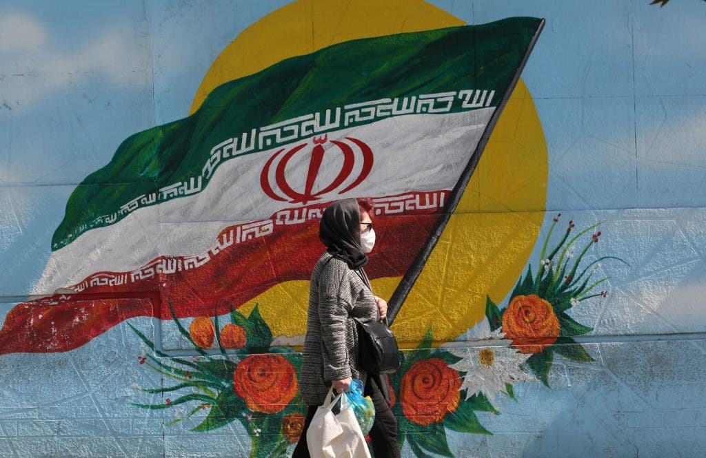 An Iranian woman wears a face mask as a COVID-19 coronavirus pandemic precaution, in Iran's capital Tehran on October 14, 2020. (AFP)