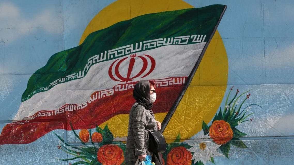 An Iranian woman wears a face mask as a COVID-19 coronavirus pandemic precaution, in Iran's capital Tehran on October 14, 2020. (AFP)