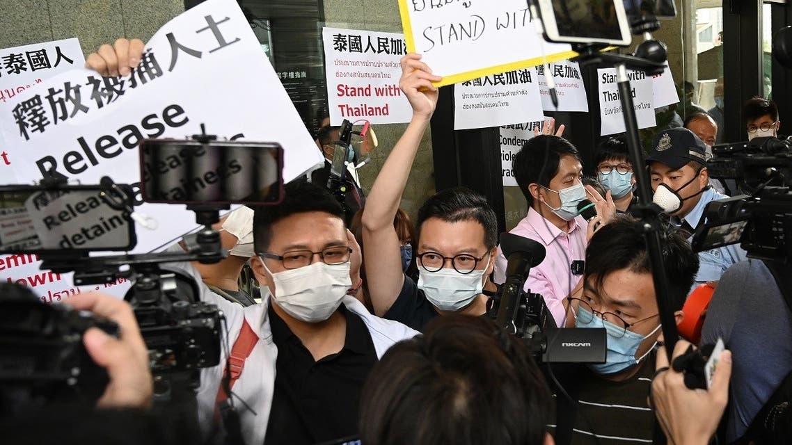 Activists demonstrate in solidarity with ongoing pro-democracy protests in Thailand, outside the office building where the Thai consulate is located in Hong Kong on October 19, 2020. (AFP)