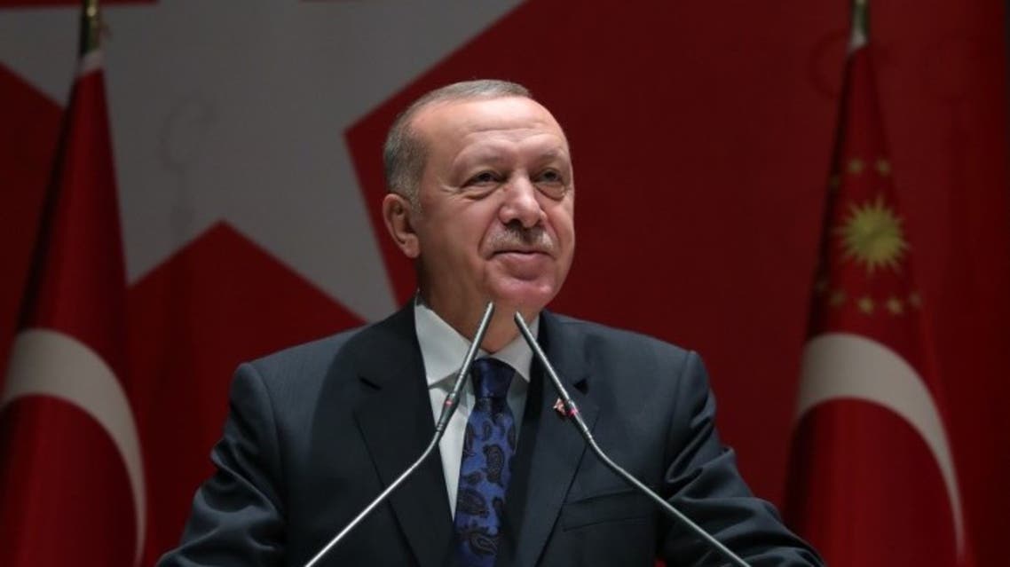 A hand out image made available by the Turkish Presidential Press Service, shows Turkey's President Recep Tayyip Erdogan speaking to members of the ruling AKP party in Ankara, on December 26, 2019. (AFP)