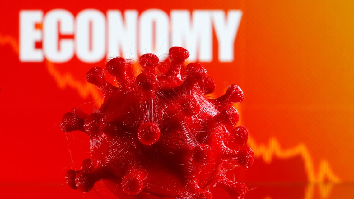 A 3D-printed coronavirus model is seen in front of a stock graph and the word Economy on display in this illustration taken March 25, 2020. (Reuters)