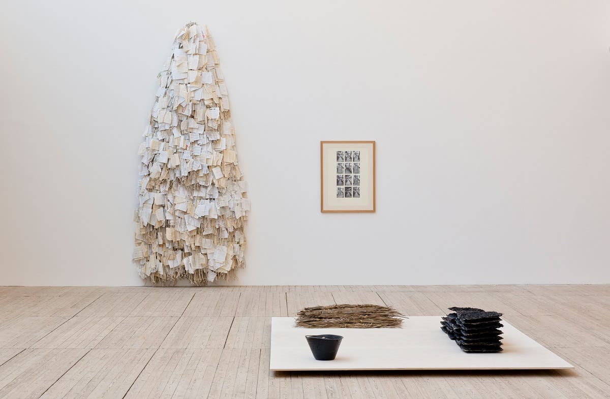 Dictionary. 1981.Photographs and pencil on mounting board and glue, dictionary pages and cotton rope. Installation view: Hassan Sharif: I Am The Single Work Artist, Malmö Konsthall, 2020. (Sharjah Art Foundation Collection. Photo: Helene Toresdotter)