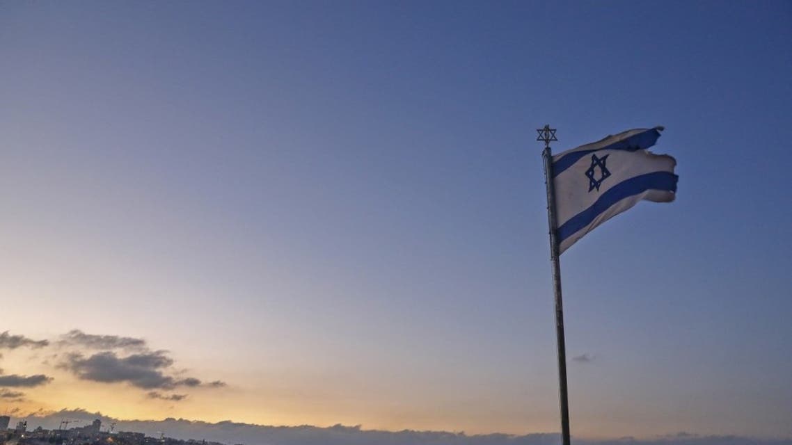 An Israeli flag flutters at the Mount of the Olives with a view of the Dome of the Rock in Jerusalem's al-Aqsa mosque compound (background) on September 23, 2020. (AFP)
