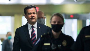 John Ratcliffe, Director of National Intelligence, is escorted by US Capitol police officers in Washington, May 5, 2020. (Reuters)