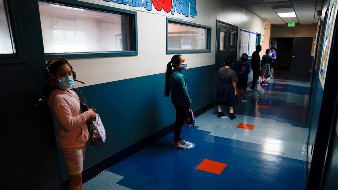 Los Angeles Unified School District students stand in a hallway socially distance during a lunch break at Boys & Girls Club of Hollywood in Los Angeles. (AP)