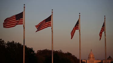 The United States Capitol is pictured among U.S. flags during sunset in Washington. (Reuters)