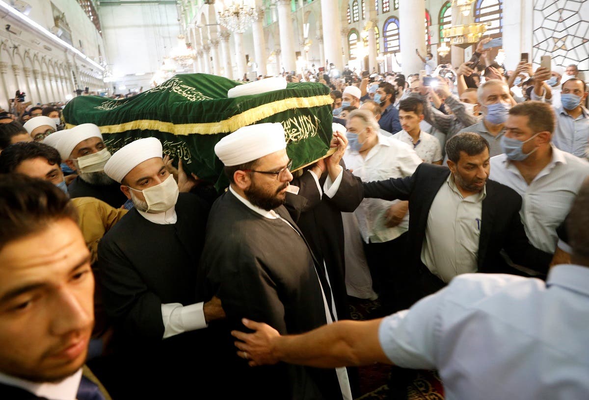 Mourners hold the coffin of Sunni Muslim Mufti Sheikh Mohammed Adnan Afiouni, during his funeral at Umayyad mosque in Damascus. (Reuters)