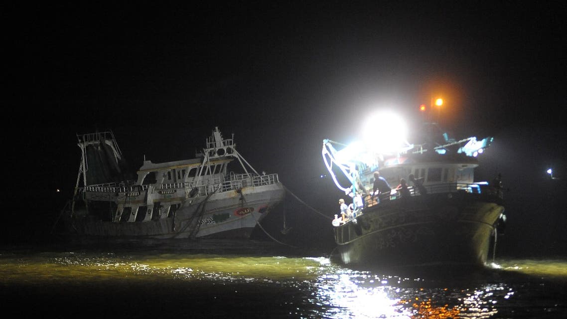 A picture taken in the Egyptian port city of Rosetta on September 27, 2016 shows the arrival of wreck of a migrant boat raised by the Egyptian navy and maritime rescuers. (AFP)
