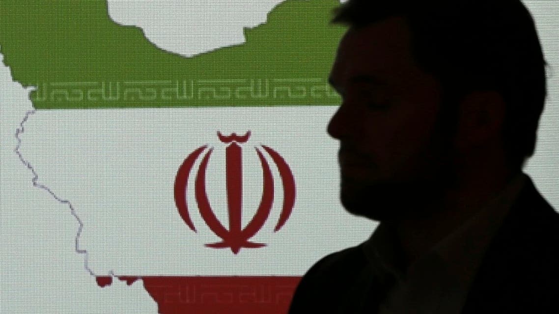 Stuart Davis, a director at one of FireEye's subsidiaries, stands in front of a map of Iran as he speaks to journalists about the techniques of Iranian hacking, Sept. 20, 2017, in Dubai. (AP)