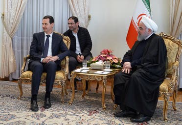 A handout picture released by the official Syrian Arab News Agency (SANA) on February 25, 2019 shows Syria's President Bashar al-Assad (L) during a meeting with his Iranian counterpart Hassan Rouhani in Tehran. 