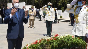 Algeria's President Abdelmajid Tebboune praying during a ceremony to lay to rest the remains of 24 resistance fighters. (AFP)