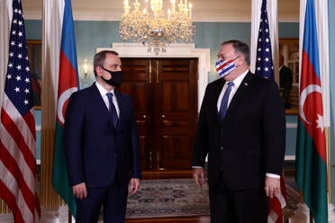 US Secretary of State Mike Pompeo acknowledges members of the news media as he meets with Azerbaijan's Foreign Minister Jeyhun Bayramov to discuss the conflict in Nagorno-Karabakh, at the State Department in Washington, US, October 23, 2020. (Reuters)