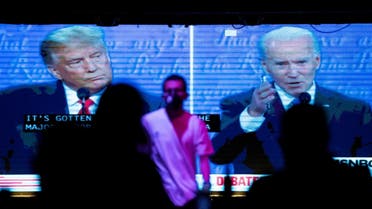 People watch the second 2020 presidential campaign debate between Democratic presidential nominee Joe Biden and U.S. President Donald Trump at The Abbey Bar during the outbreak of the coronavirus disease (COVID-19), in West Hollywood, California. (Reuters)