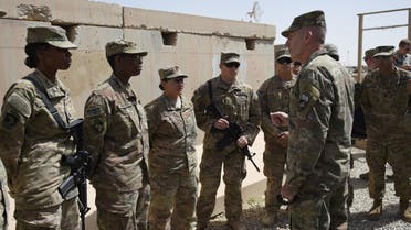 The US commander in Afghanistan John Nicholson (R) talks with soldiers ahead of a handover ceremony at Leatherneck Camp in Lashkar Gah in the Afghan province of Helmand on April 29, 2017. US Marines returned to Afghanistan's volatile Helmand April 29, where American troops faced heated fighting until NATO's combat mission ended in 2014, as embattled Afghan security forces struggle to beat back the resurgent Taliban. The deployment of some 300 Marines to the poppy-growing southern province came one day after the militants announced the launch of their spring offensive, and as the Trump administration seeks to craft a new strategy in Afghanistan.