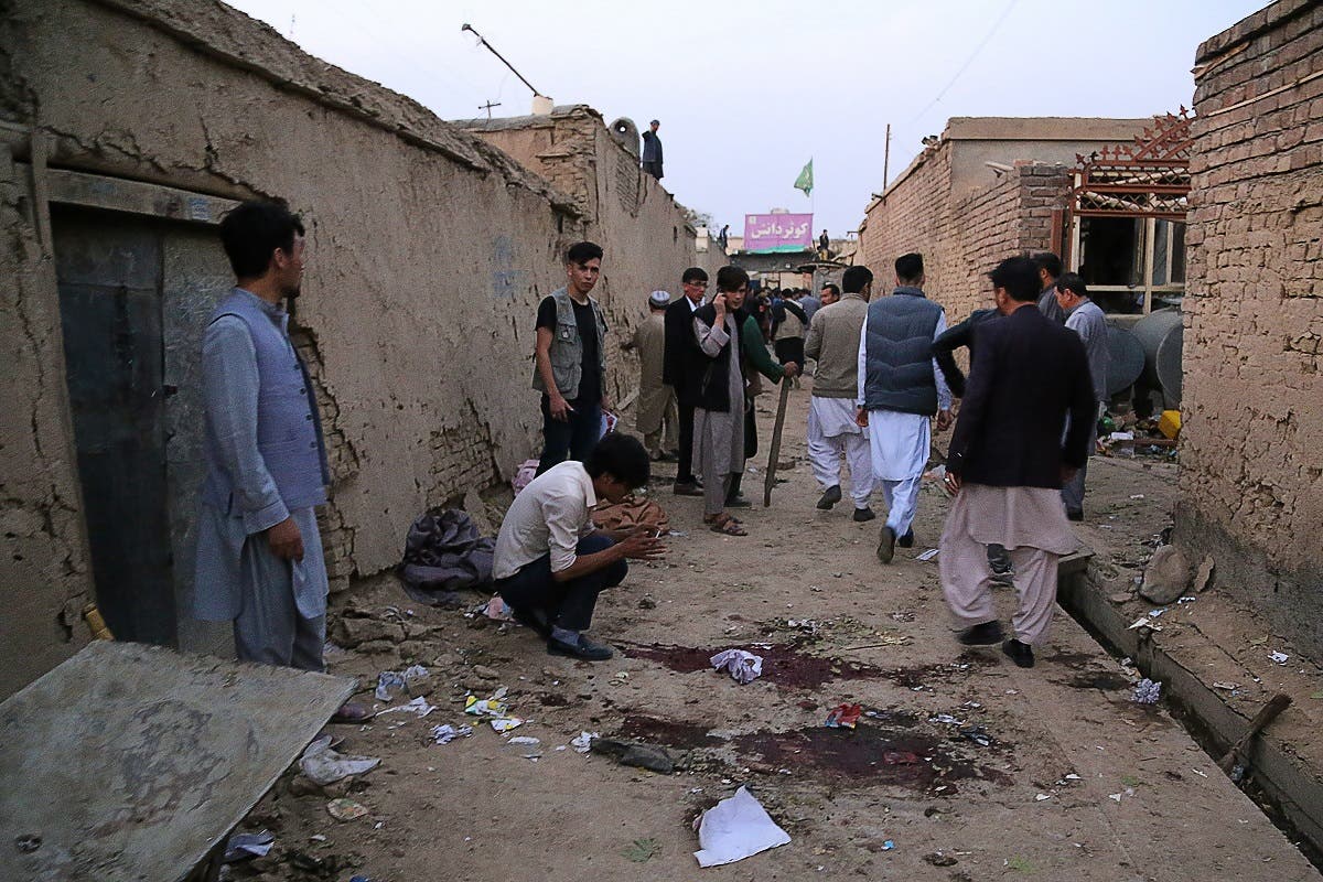 Residents gather at a site following a suicide bomber blew himself up in an education centre, in Kabul on October 24, 2020. (AFP)