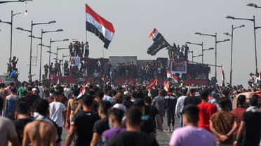 Iraqi protesters gather on Al-Jumhuriya Bridge in the capital Baghdad on October 25, 2020. (AFP)