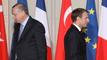 French President Emmanuel Macron (R) and Turkish President Recep Tayyip Erdogan walk during a joint press conference at the Elysee Palace in Paris, France, January 5, 2018. (Reuters)